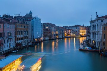Fototapeta na wymiar Northeast view from the Accademia bridge in Venice with light trails from the Vaporetto water bus