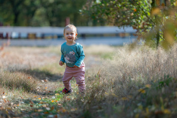 Adorable girl having fun on beautiful autumn day