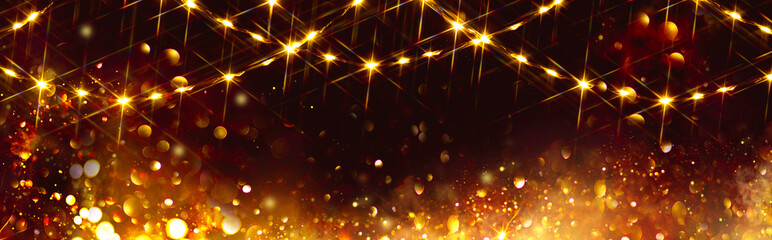 Golden Christmas and New Year glittering stars swirl on black bokeh background, backdrop with...