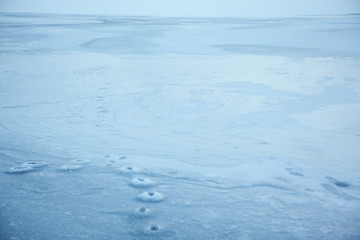 ice surface on a frozen lake in a winter day