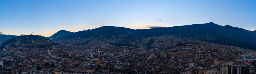 Fototapeta na wymiar Summer sunset in Quito, panoramic view of the old city