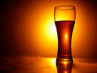 glass of beer on black background