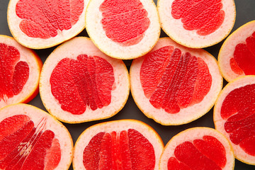 Fresh cut grapefruit on dark background