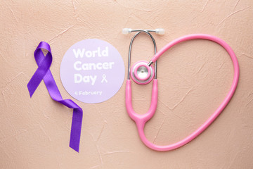 Paper with text WORLD CANCER DAY, stethoscope and purple ribbon on color background