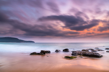 Naklejka premium Soft Dawn Seascape with Smoky Haze and Clouds at the Seaside