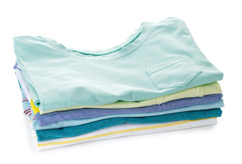 Stack of clean kid clothes on white background