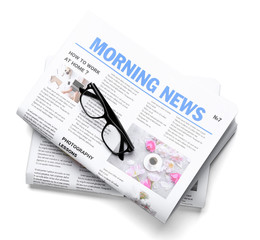 Morning newspapers on white background