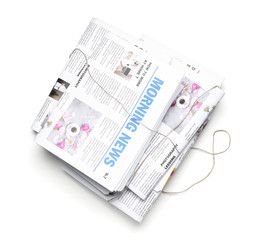 Morning newspapers on white background