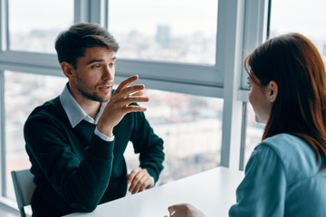 businessman and businesswoman talking on cell phone