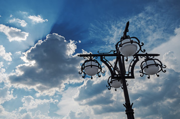 Fototapeta na wymiar Street lamp against a cloudy sky