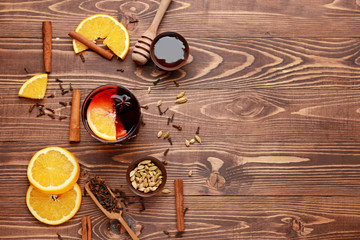 Composition with tasty mulled wine on wooden background