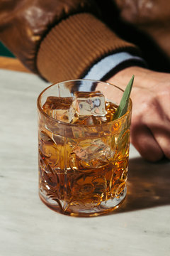 Amaro sour, a cocktail with Amaro Lucano, Luxardo or Averna; bourbon or whiskey; freshly squeezed lemon juice and simple syrup, garnished with sage