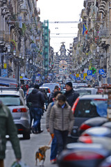 A busy street scene in Catania, Sicily (Italy) - Via Giuseppe Garibaldi. 