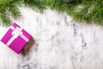 Christmas tree with a gift on a white background