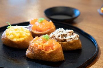 A plate of sushi with beancurd skin