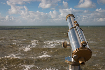 Obraz na płótnie Canvas Monocular telescope at north sea shore.