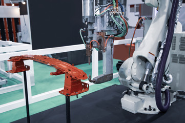 Industrial robot arm demonstrate spot welding car parts