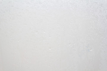 Obraz premium Shower screen with drops on a light background