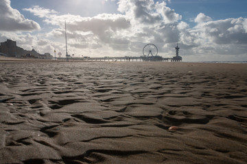 Pier of Scheveningen with ferris wheel and bungee tower, the Netherlands.