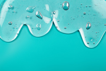 Hyaluronic acid gel. Textured background with oxygen bubbles on blue background.
