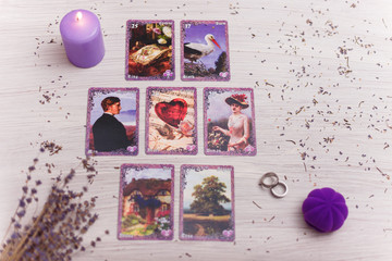 Divination cards alignment in the heart shape for love and family. Men and women relationships, astrology, fortune telling and belief concept.