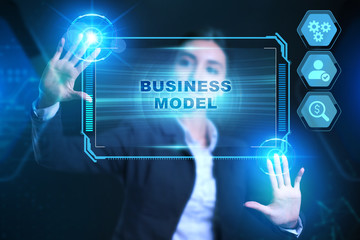 Business, Technology, Internet and network concept. Businessman presses a button Business model on the virtual screen tablet future.