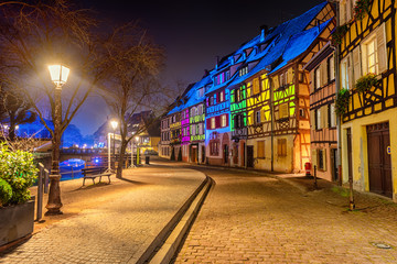 Medieval houses illuminated on Christmas in Colmar, Alsace, France - obrazy, fototapety, plakaty