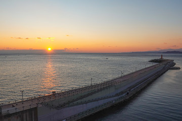 Obraz premium Beautiful seascape with lighthouse on sunrise.