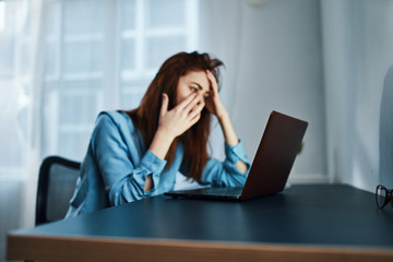 businesswoman talking on phone in her office