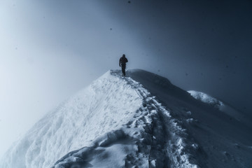 man on top of mountains