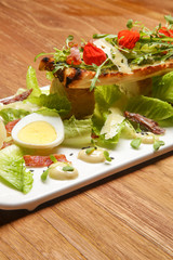 Chicken Caesar salad. Exquisite dish. Creative restaurant meal concept.