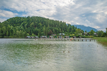 Fototapeta premium lake in the mountains in austrian alps in beautiful summer tourist season with blue sky and clear water