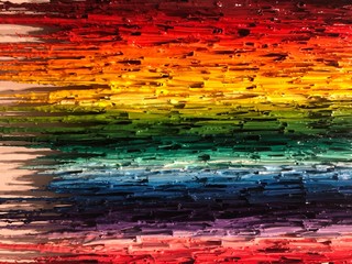 Rainbow of powdered paint spurting forward