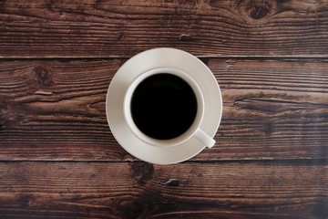 cup of coffee on wooden table