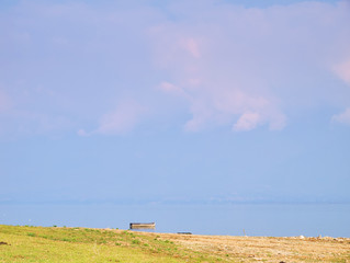 Kerkini lake, Greece, minimalism landscape, one wooden boat on calm water.