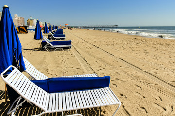 Lounge chairs and umbrellas awaiting seaside visitors at Virginia Beach, Virginia