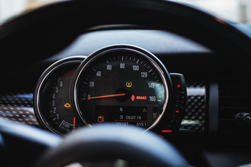 Modern car dashboard with speedometer, rpm meter and indicators