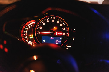 Modern car dashboard with speedometer, rpm meter and indicators
