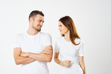 young couple in t-shirts chatting
