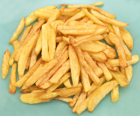 The french fries is ready to be eaten. Golden french fries cooked in oil. Tasty but not healthy.