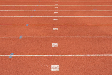 Fototapeta premium The striped lane in running track or athlete track in stadium. Running track is a rubberized artificial running surface for track and field athletics.