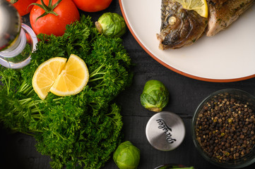 Ready cooked fish on a background with vegetables. Cooking recipes, restaurant business, culinary recipes