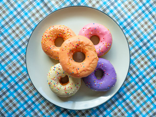 Donuts various flavor have color Orange White Purple Pink,High energy foods and healthy rates,Sweet flavored candy,Mapping background