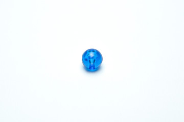 Fototapeta premium Blue beads on a white background