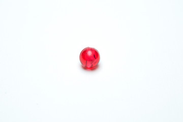 Red beads on a  white background