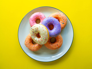 Donuts various flavor have color Orange White Purple Pink,High energy foods and healthy rates,Sweet flavored candy,Mapping background
