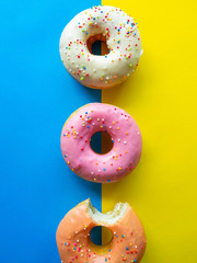 Donuts various flavor have color Orange White Purple Pink,High energy foods and healthy rates,Sweet flavored candy,Mapping background