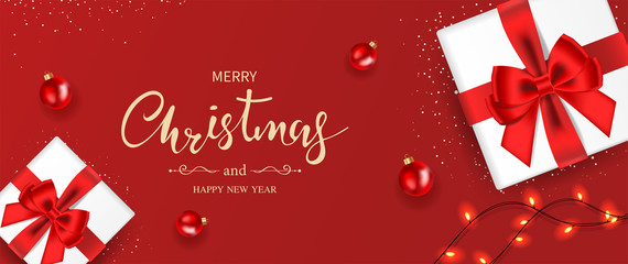 Christmas banner. Background Xmas decorated with gifts box, sparkling lights, red balls, and snowflakes. Top view. Vector illustration.