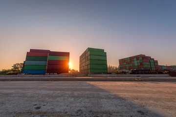 Industrial Container yard for Logistic Import Export business at sun sunrise background