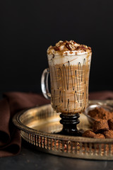 Close up of hot cappuccino with truffles.